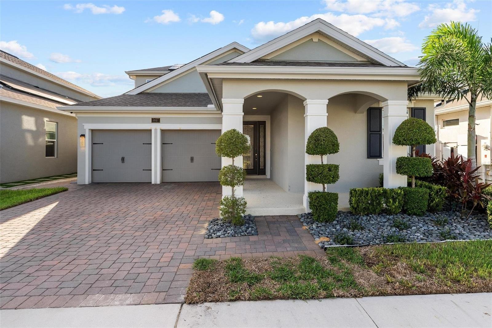 front of home with columns and two car garage